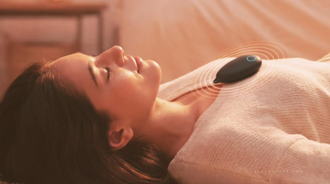 Woman using the Sensate vagus nerve device during a nighttime relaxation ritual to reduce anxiety
